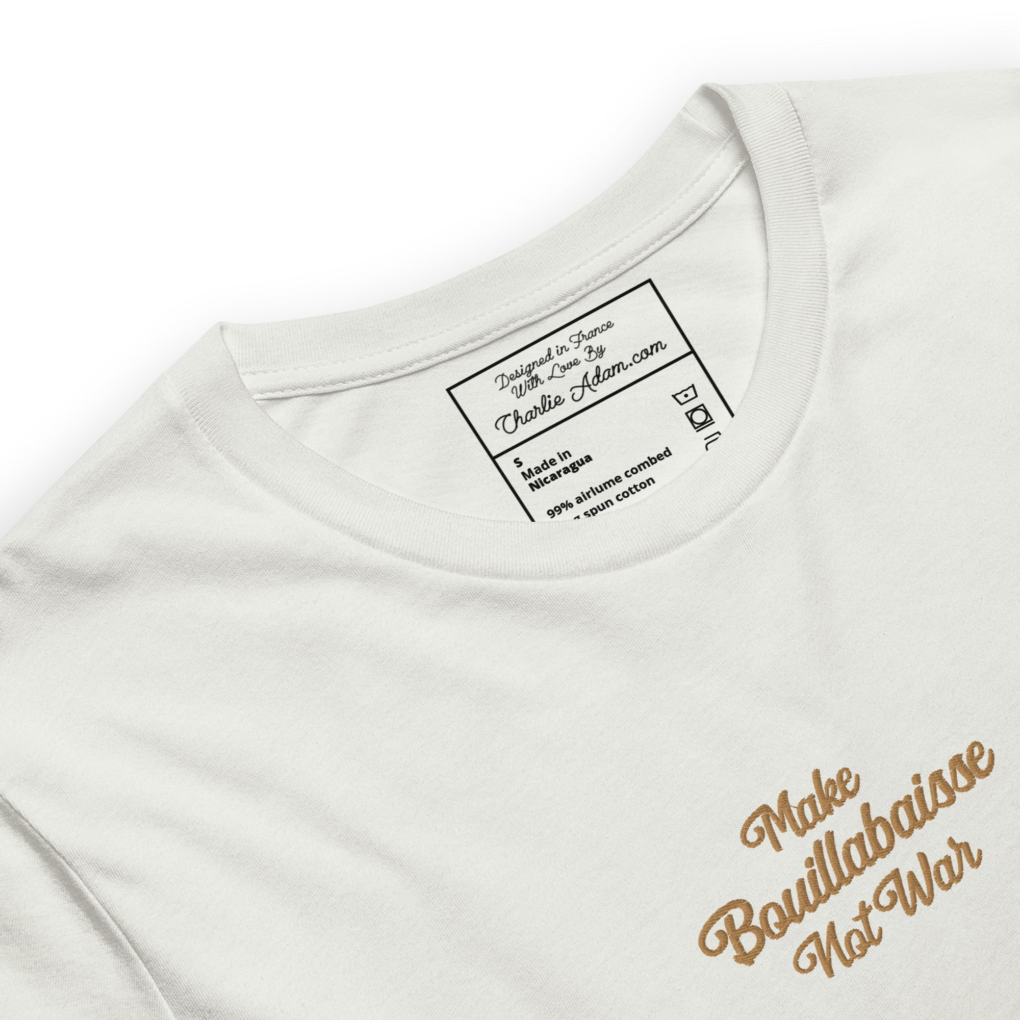 Unisex t-shirt Make Bouillabaisse Not War Text Only old gold embroidered pattern on light heather colors