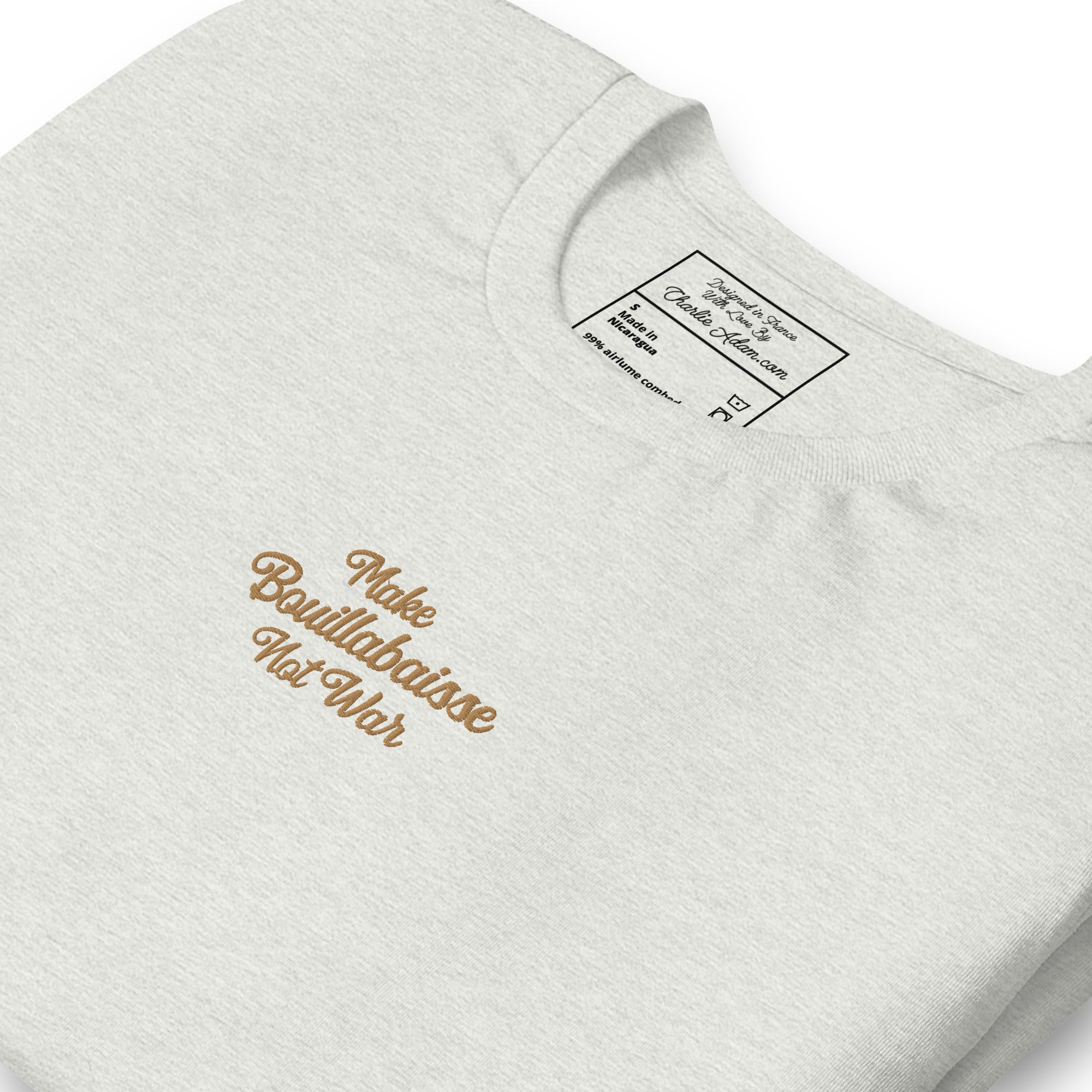 Unisex t-shirt Make Bouillabaisse Not War Text Only old gold embroidered pattern on light heather colors
