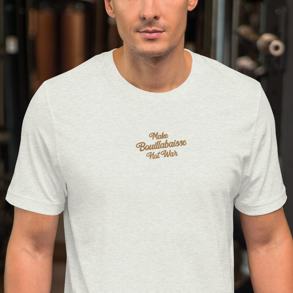 Unisex t-shirt Make Bouillabaisse Not War Text Only old gold embroidered pattern on light heather colors