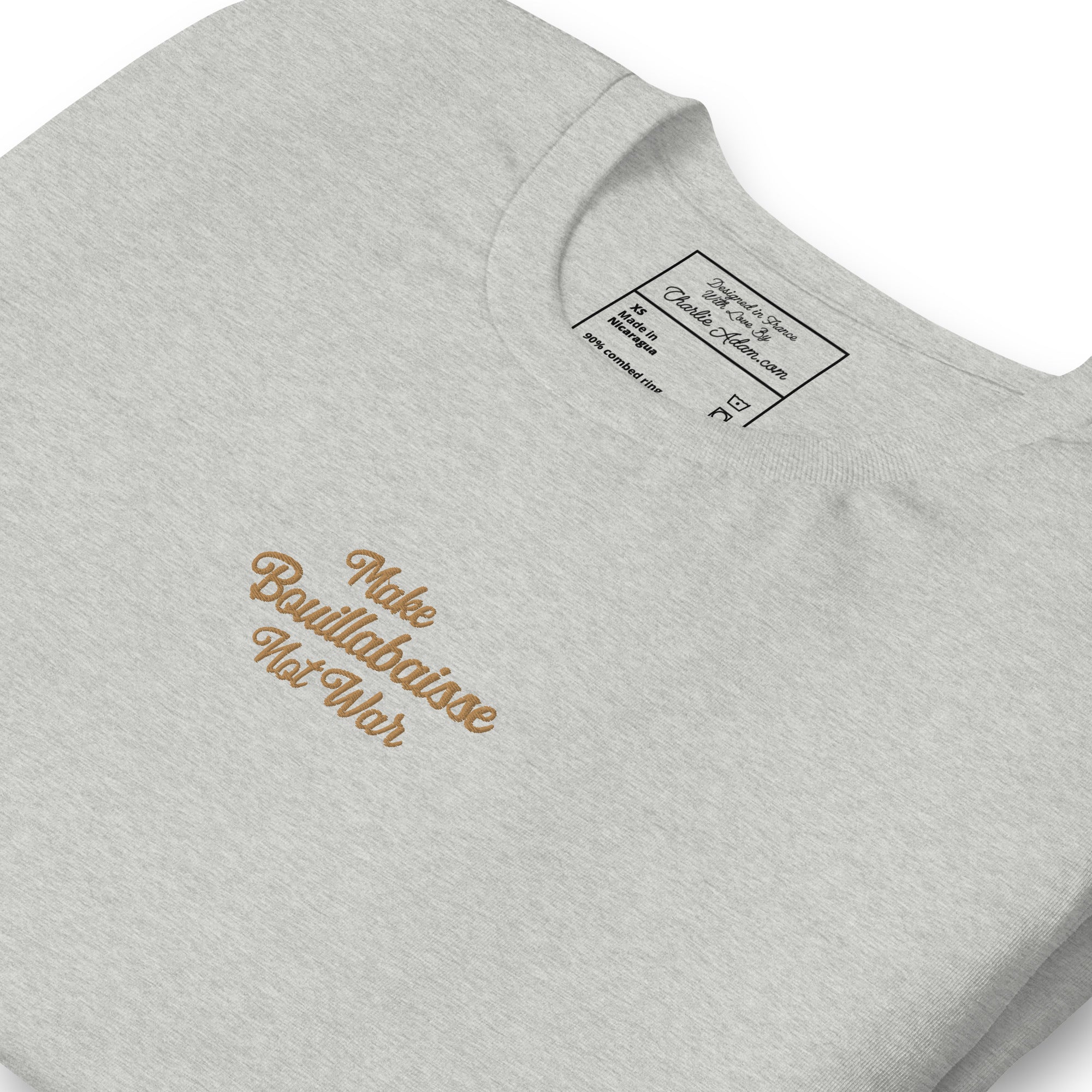Unisex t-shirt Make Bouillabaisse Not War Text Only old gold embroidered pattern on light heather colors