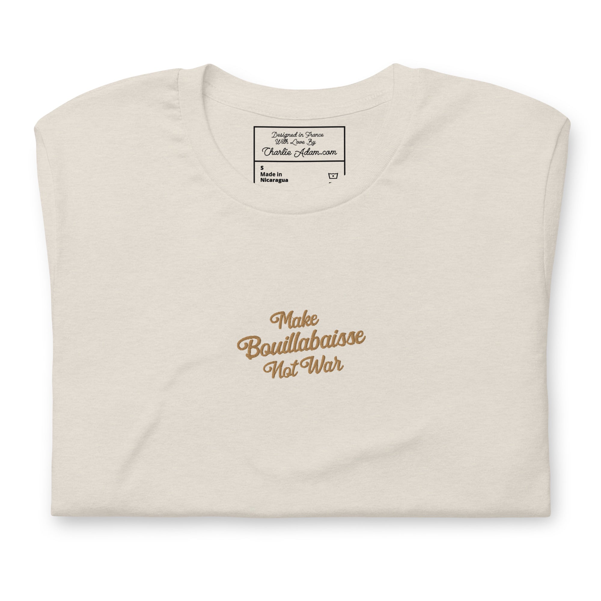 Unisex t-shirt Make Bouillabaisse Not War Text Only old gold embroidered pattern on light heather colors