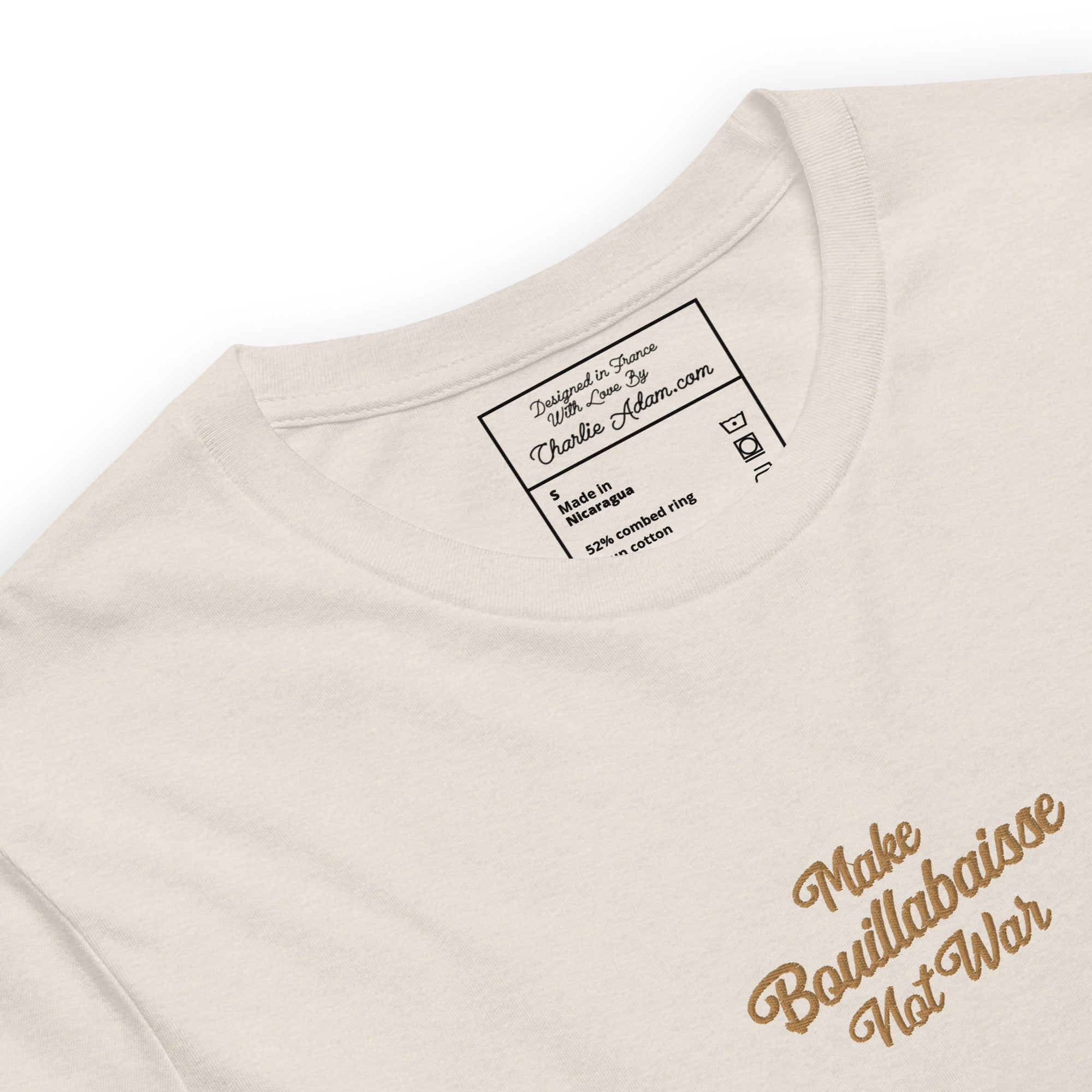 Unisex t-shirt Make Bouillabaisse Not War Text Only old gold embroidered pattern on light heather colors