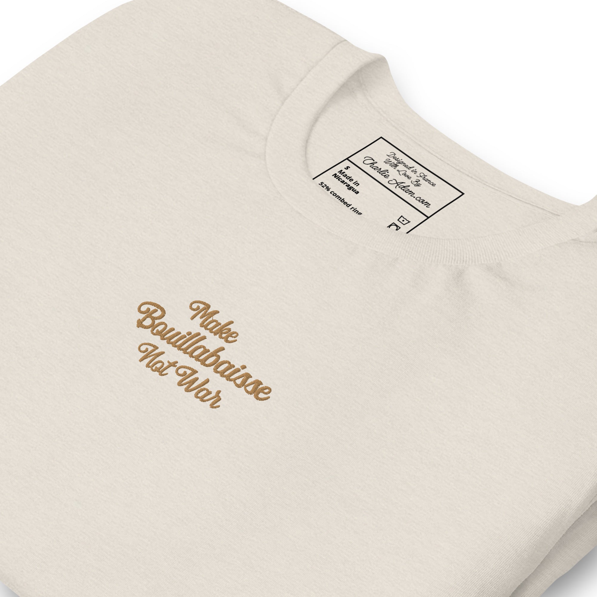 Unisex t-shirt Make Bouillabaisse Not War Text Only old gold embroidered pattern on light heather colors