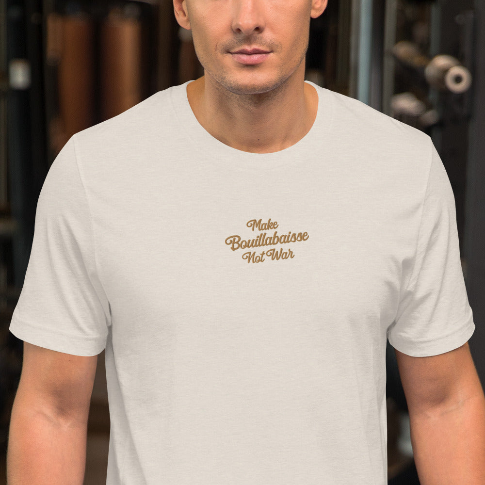 Unisex t-shirt Make Bouillabaisse Not War Text Only old gold embroidered pattern on light heather colors