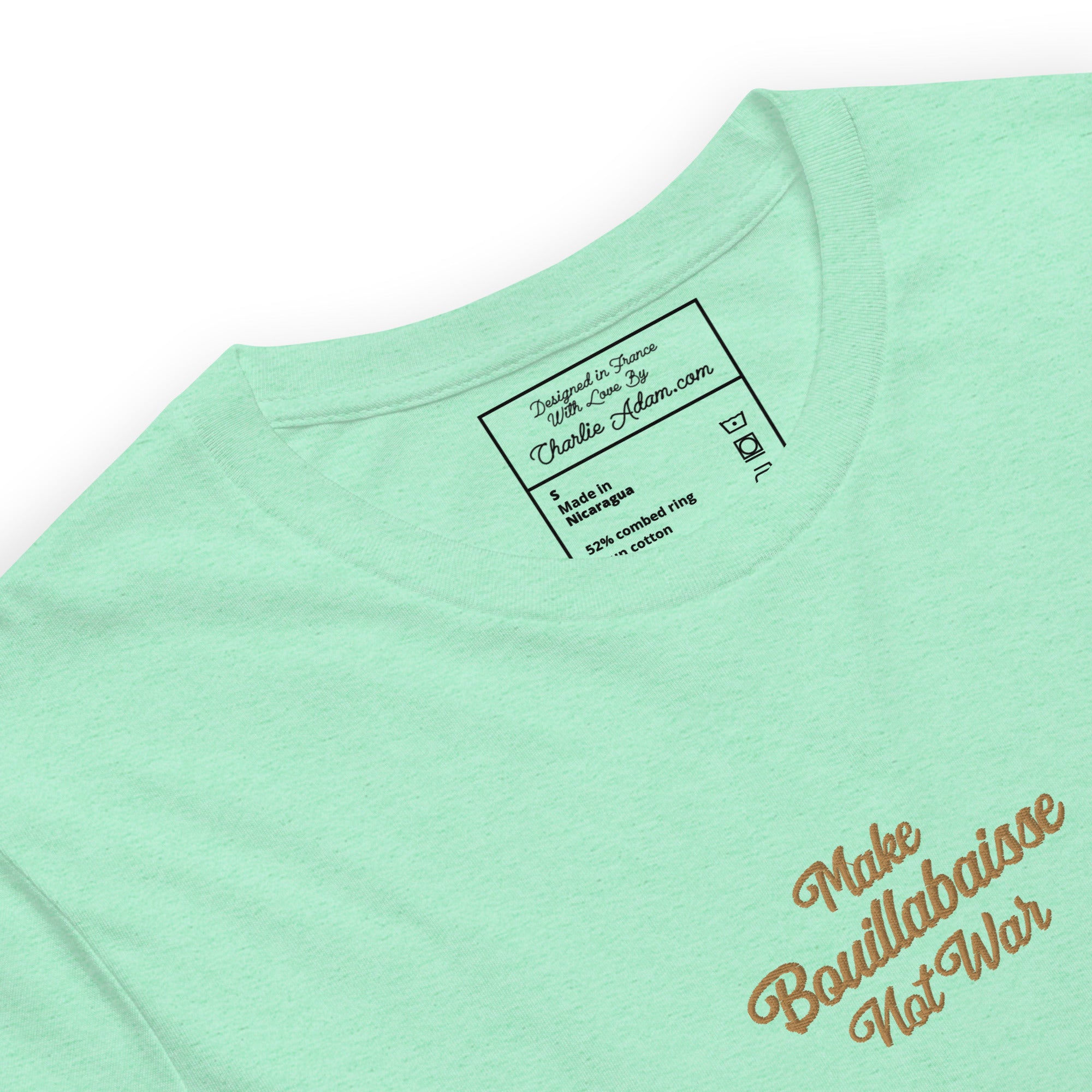 Unisex t-shirt Make Bouillabaisse Not War Text Only old gold embroidered pattern on light heather colors