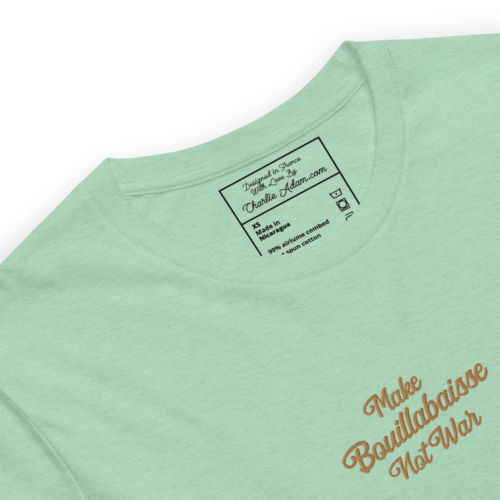 Unisex t-shirt Make Bouillabaisse Not War Text Only old gold embroidered pattern on light heather colors