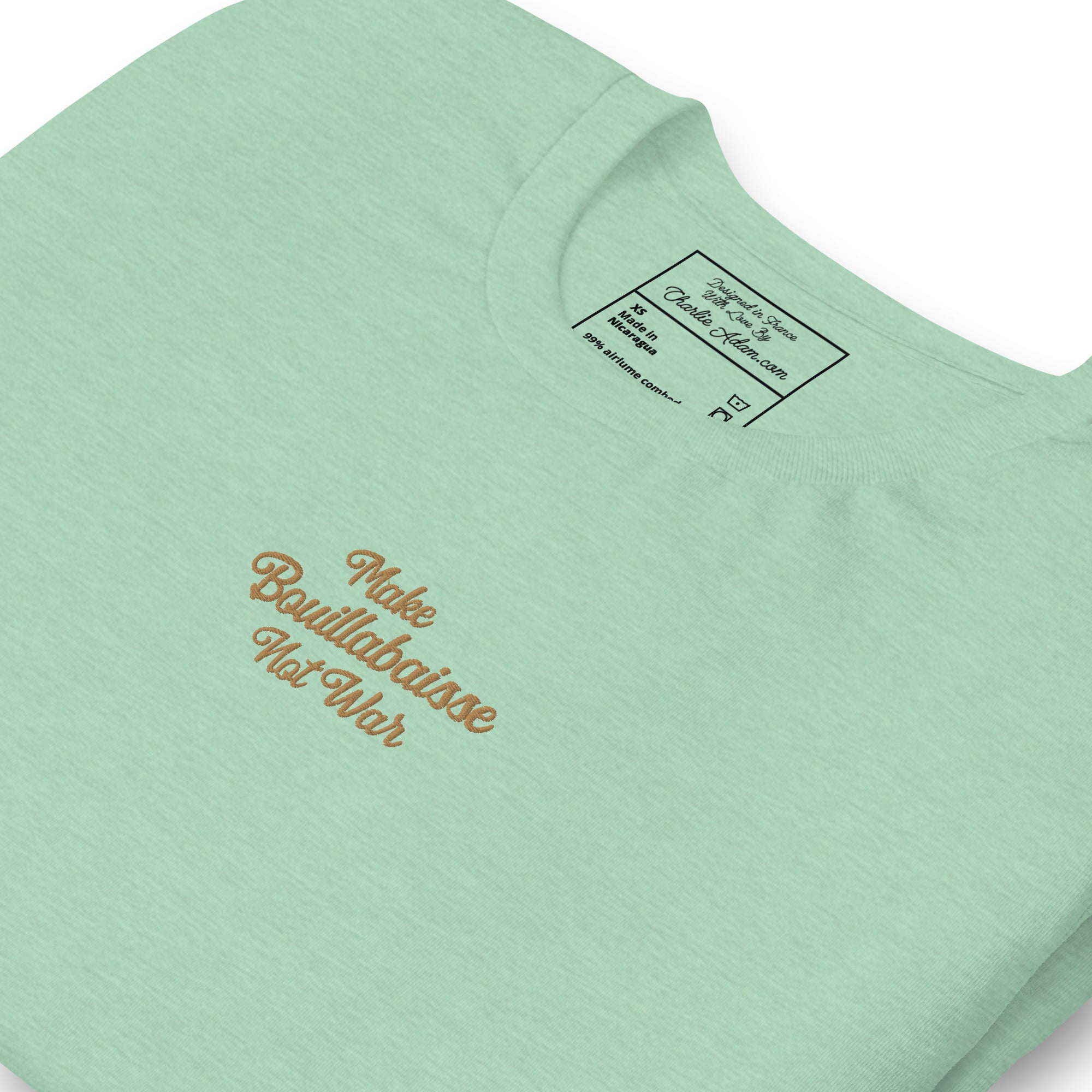 Unisex t-shirt Make Bouillabaisse Not War Text Only old gold embroidered pattern on light heather colors