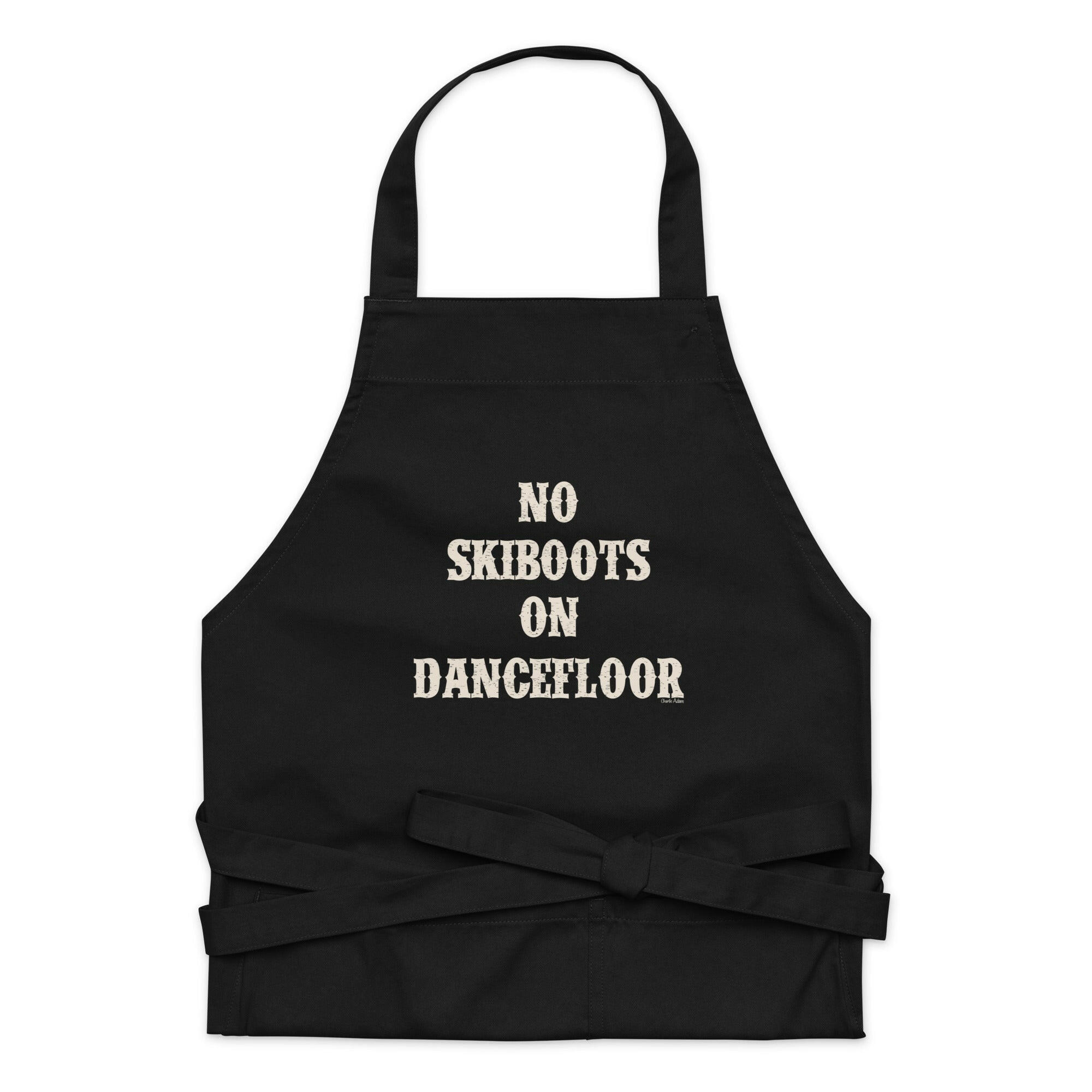 Tablier en coton biologique No Skiboots on Dancefloor sur fond sombre