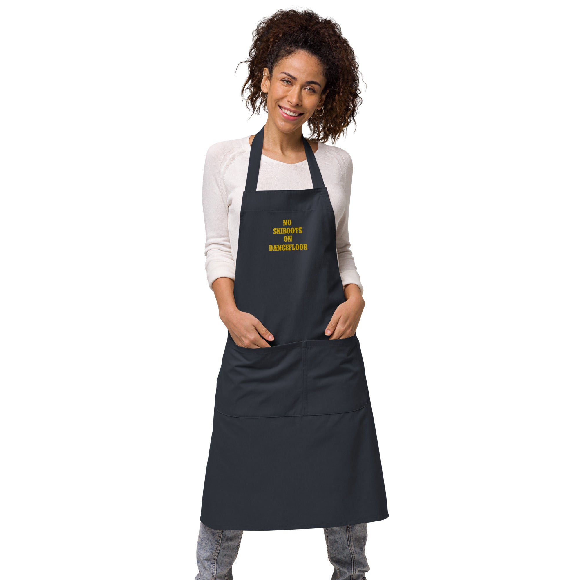 Organic cotton apron No Skiboots on Dancefloor gold embroidered pattern