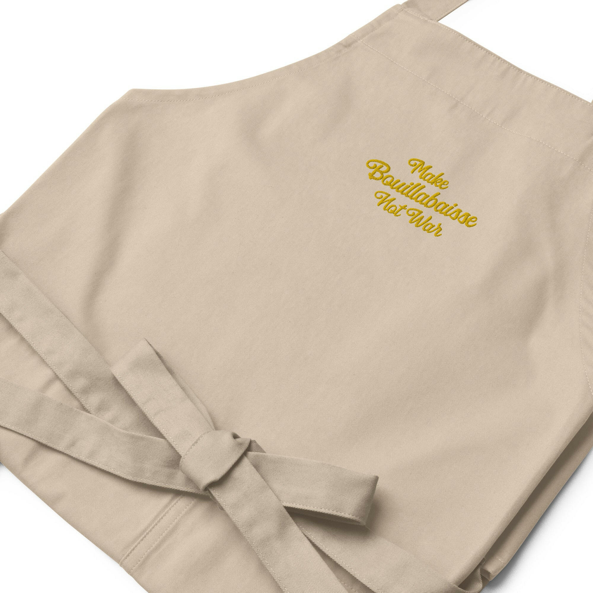 Organic cotton apron Make Bouillabaisse Not War Embroidered pattern