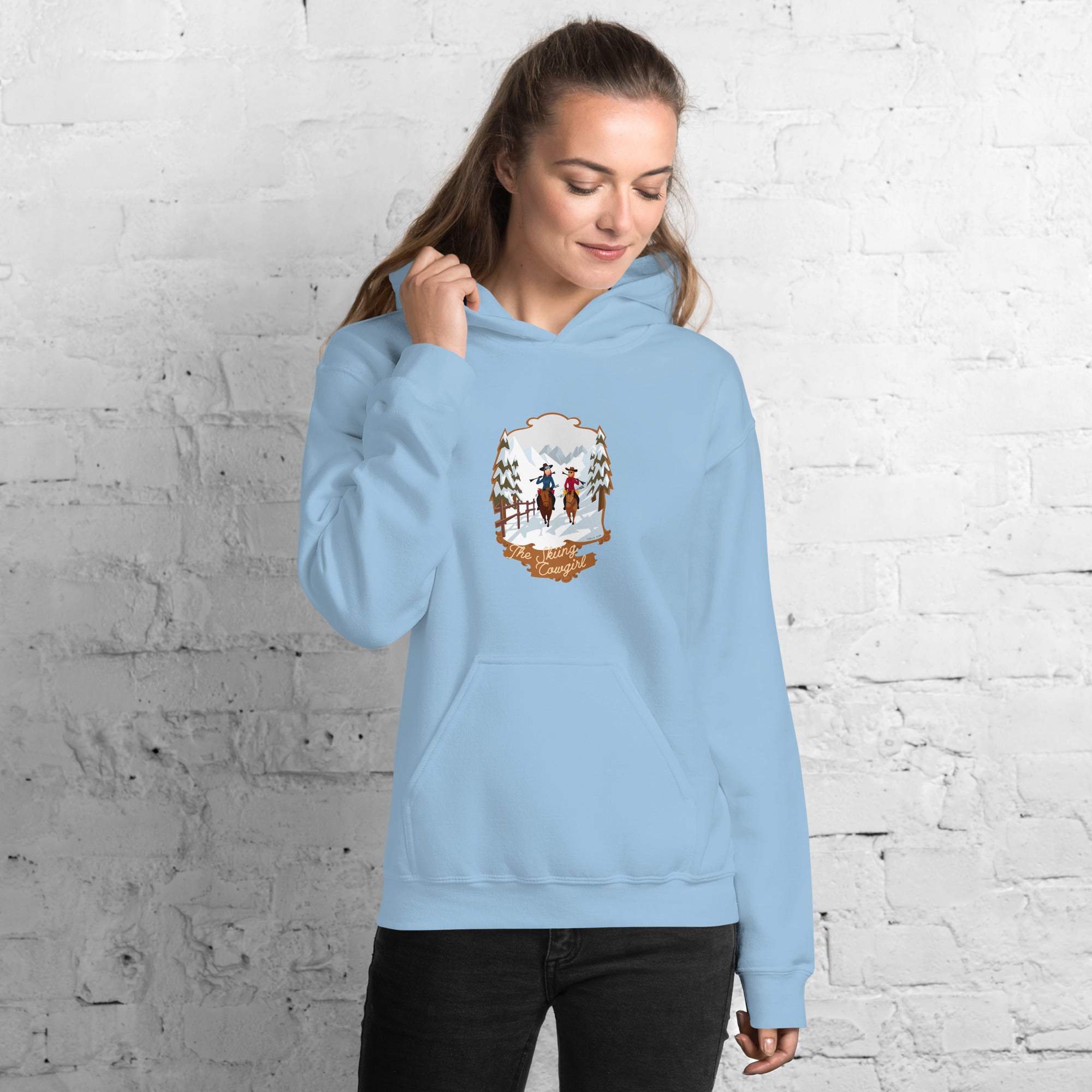 Sweat à capuche d'hiver unisexe The Skiing Cowgirl sur couleurs claires